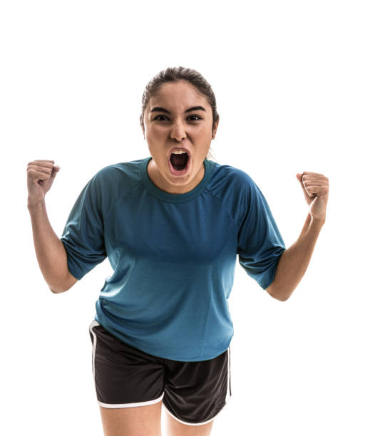 istock Female athlete / fan on blue uniform celebrating on white background 909932546