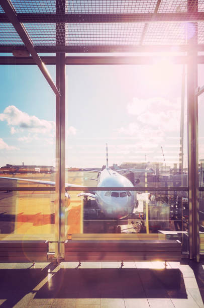 istock Departure hall at an airport at sunset. 909934938
