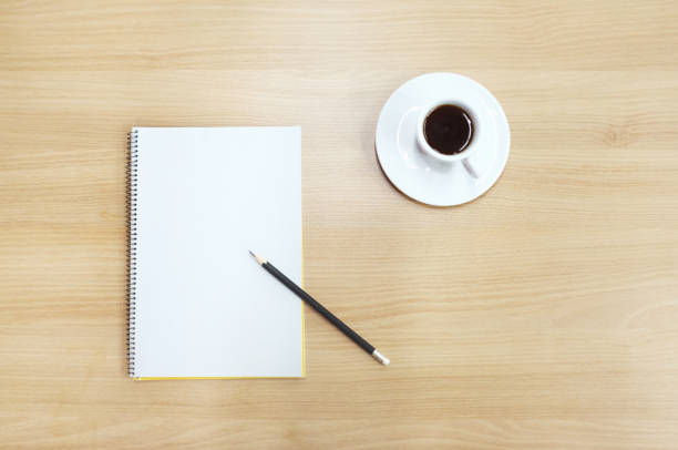 istock a note, a pencil and a cup of coffee on the desk 909935116