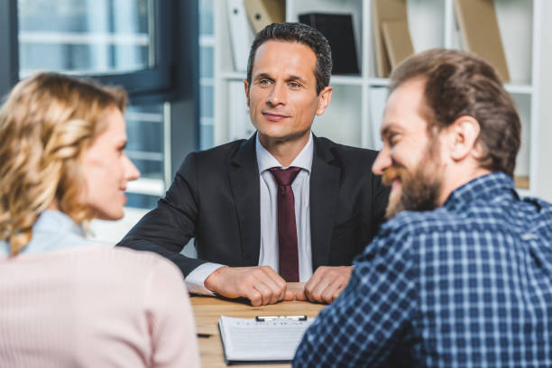 istock couple at lawyers office 909935900