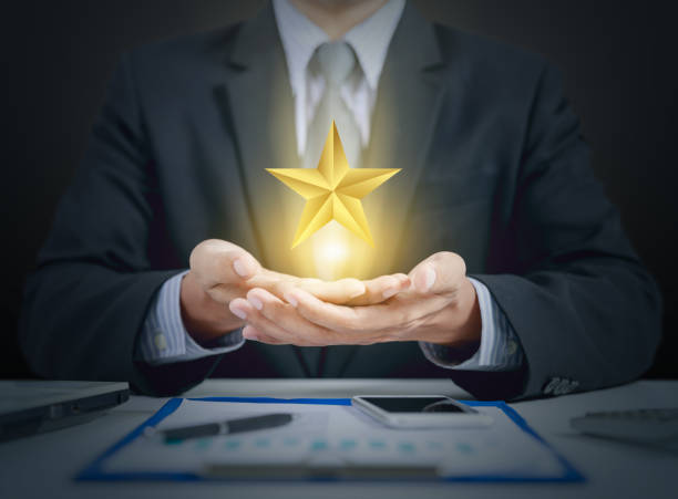 istock businessman and star evaluation, winner concept 909938420