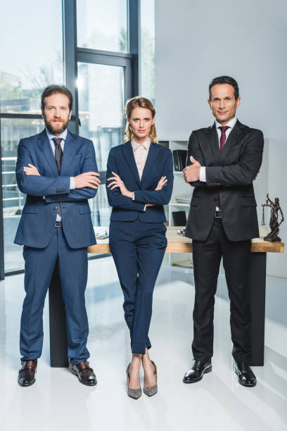 istock lawyers with arms crossed 909945476