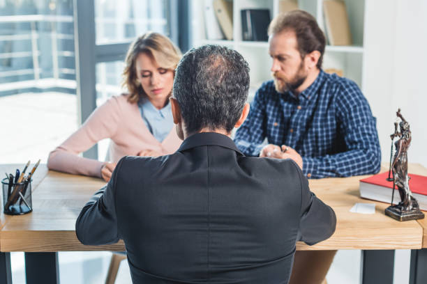 istock couple having meeting with lawyer 909945632