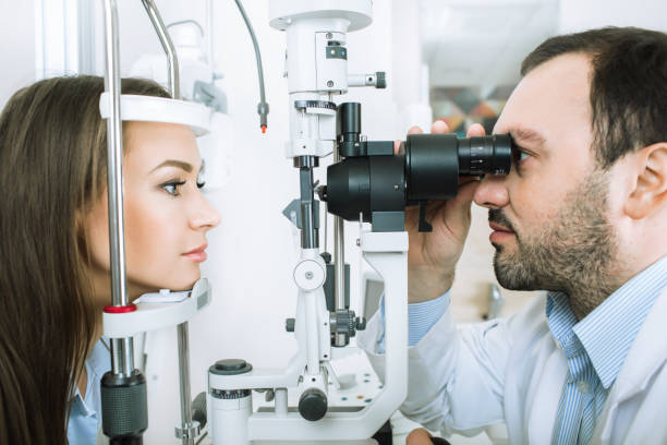 istock Ophthalmologist examining female patient 909946242