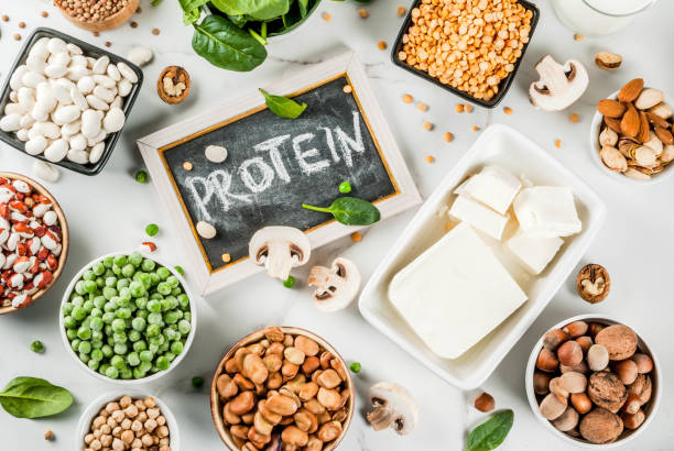 Vegan  protein sources Healthy diet vegan food, veggie protein sources: Tofu, vegan milk, beans, lentils, nuts, soy milk, spinach and seeds. Top view on white table. meat substitute stock pictures, royalty-free photos & images