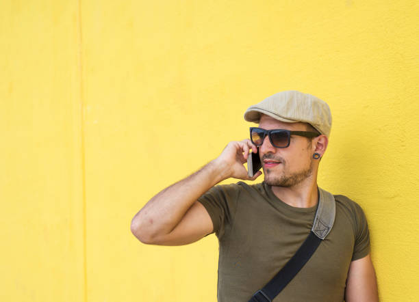 istock An urban man using a phone on the street 909946820