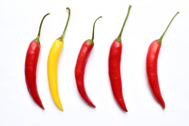 istock High Angle View Of Chili Peppers Over White Background 909948214