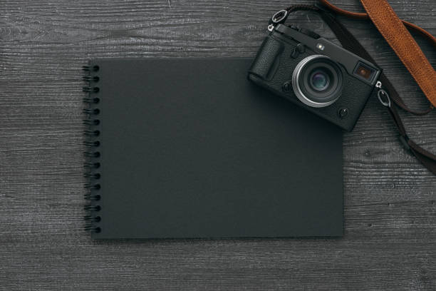 istock Photo album with camera 909949468