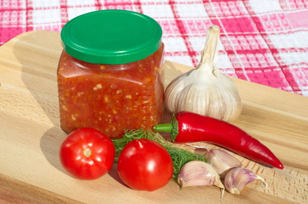 istock Hot sauce adjika from fresh vegetables 909949650