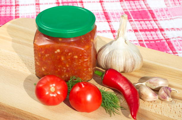istock Hot sauce adjika from fresh vegetables 909949742