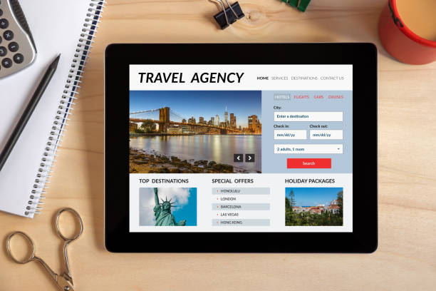 istock Travel agency concept on tablet screen with office objects 909955418