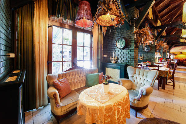 istock Sofa and armchair with table in luxury restaurant interior 909973210