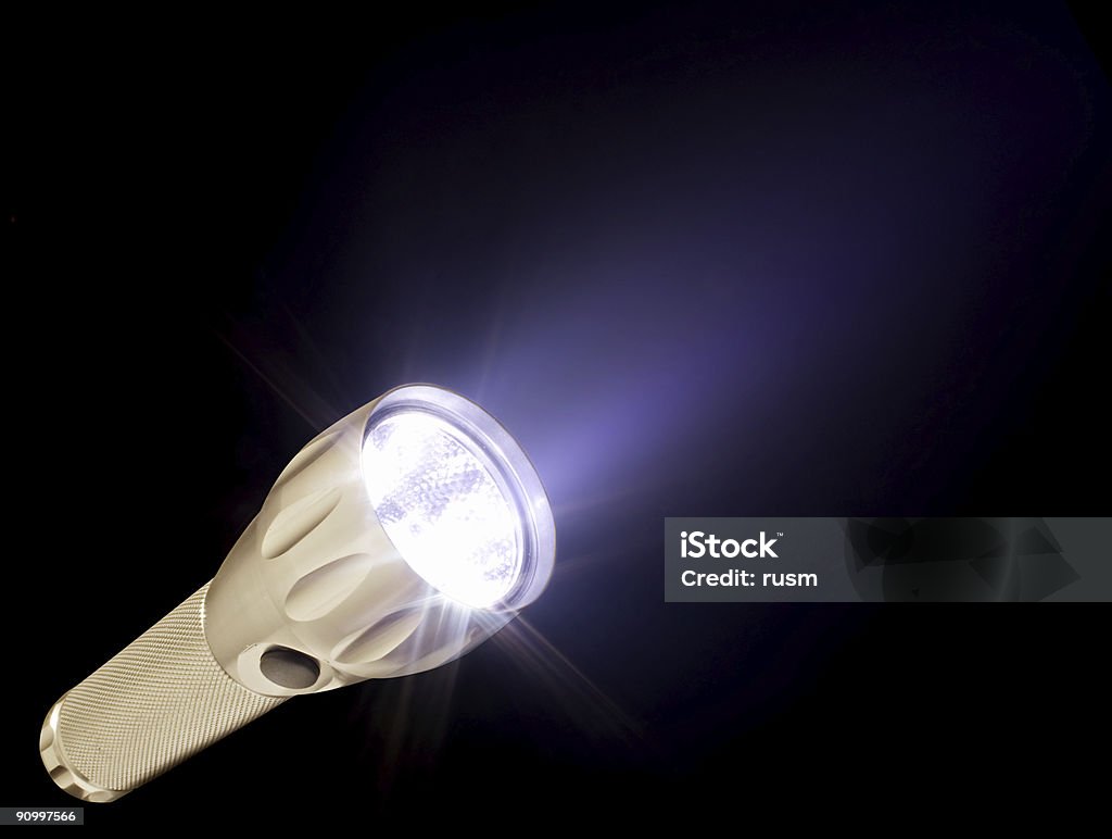 Electric torch and beam in the dark, isolated on black  Flashlight Stock Photo
