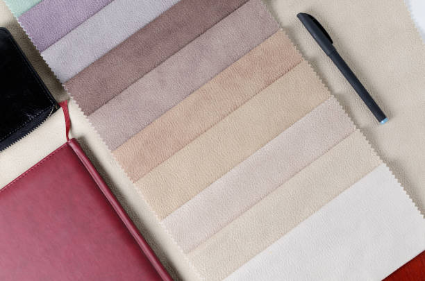 istock Bright collection of colorful textile samples with suede texture. Mockup with fabric samples, smartphone and wallet. 909986282