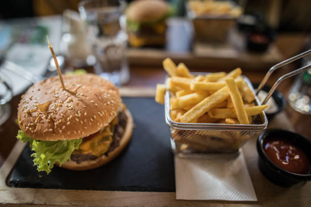 Ready to eat burger and french fries next to it