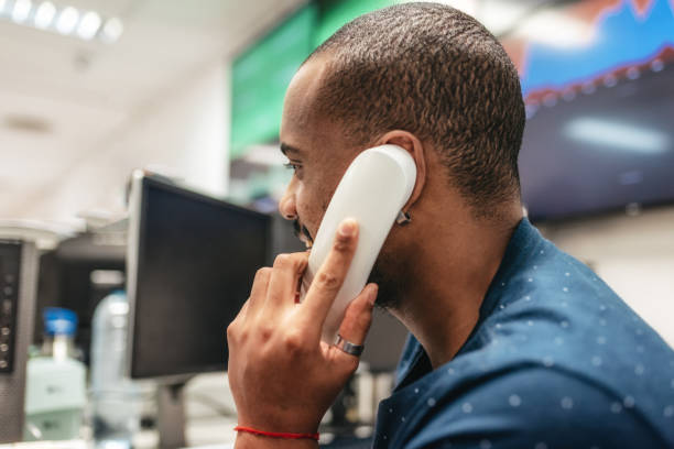 istock man talking at telephone in office 909988612