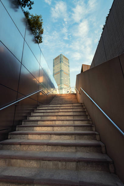 istock Pedestrian steps and office buildings 909990854