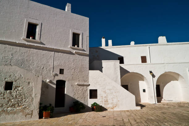 istock Old house paited in mediterranean style . 909993962