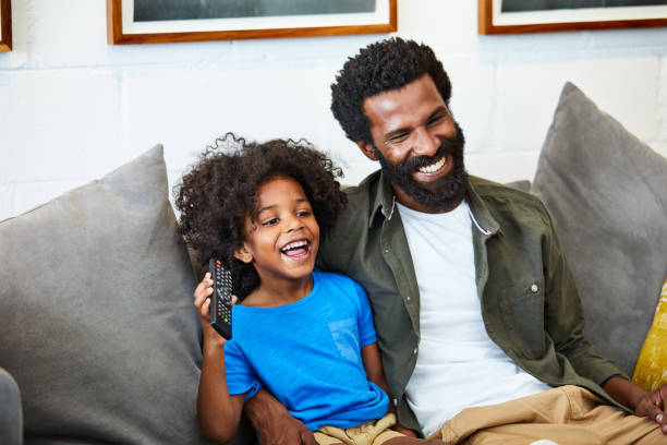 istock The boys love watching television together 909995130