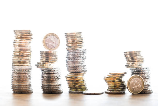istock stacks of Euro coins on bright white background savings concept 909995272