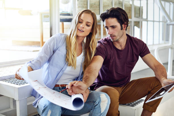 istock Pointing out any mistakes they made on the blueprints 909998244