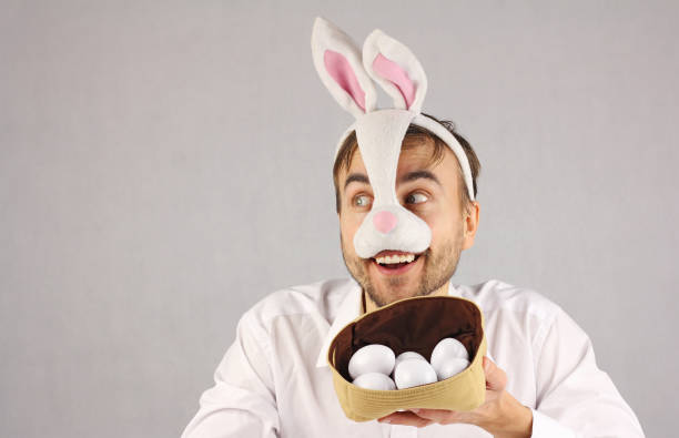 istock surprised man in the mask Easter rabbit looking to the side 910001334