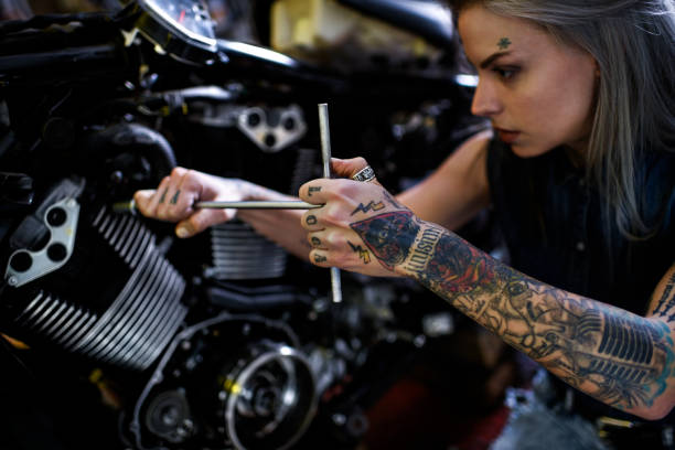Motorcycle Repair Shop Stock Photo - Download Image Now - Motorcycle,  Women, One Woman Only - iStock