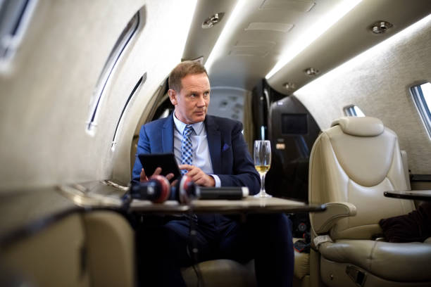 istock Man in private jet airplane 910002708