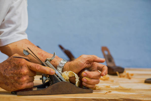 istock Carpenter working for timber table wooden 910005328