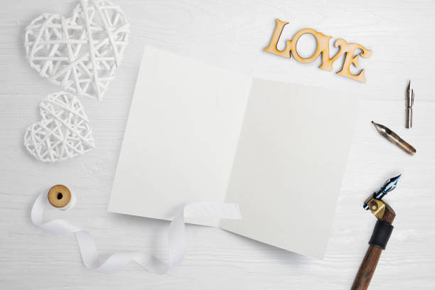 istock mockup Letter with a calligraphic pen greeting card for St. Valentine's Day in rustic style with place for your text, Flat lay, top view photo mock up 910006368