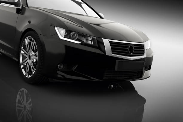 istock Modern black metallic sedan car in spotlight. Generic desing, brandless. 910009802