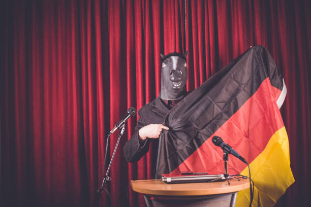 istock The man with a mask is holding a speech 910010296