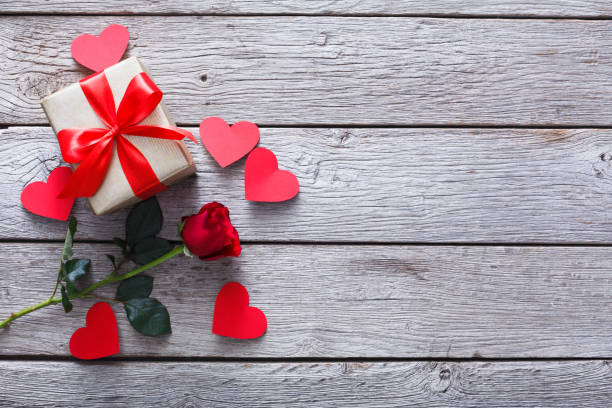 istock Valentine background, handmade hearts, rose and gift on wood 910011502