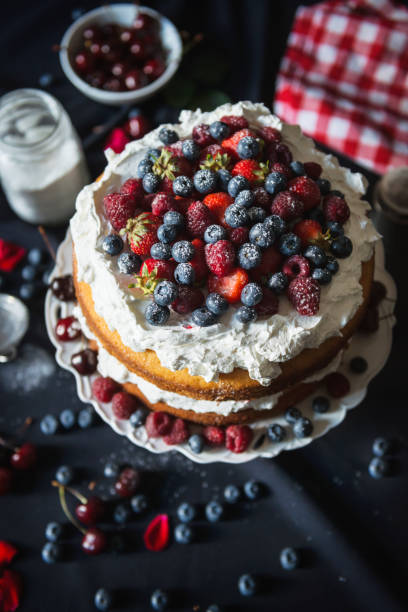 istock Beautiful, fruit naked cake on a dark tablecloth 910027240