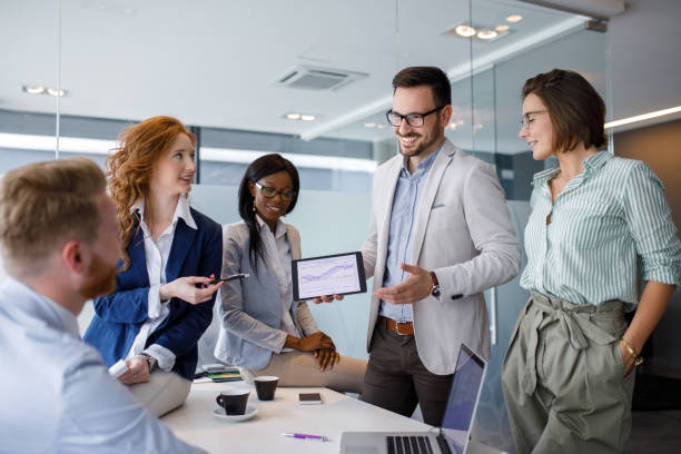 Business people discussing new market and sales analysis Business people discussing new market and sales analysis using digital tablet. growth in sales stock pictures, royalty-free photos & images