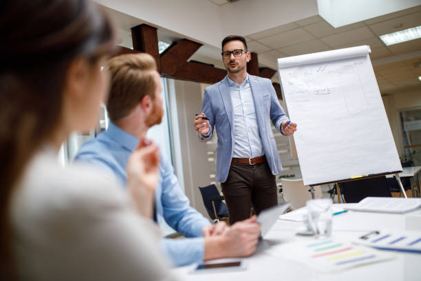 istock Businessman presenting new project to partners in the office 910030176