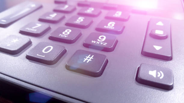 istock close up on the numbers on the keypad phone, fixed phone 910031526