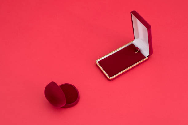 istock open the red velvet box for chain and round rings on a red background 910032550