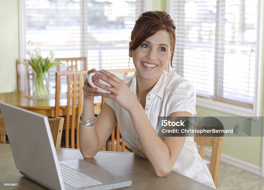Smiling woman drinking coffee  20-24 Years Stock Photo