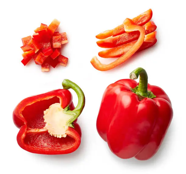 Sweet red pepper isolated on white background. Top view. Half and slices