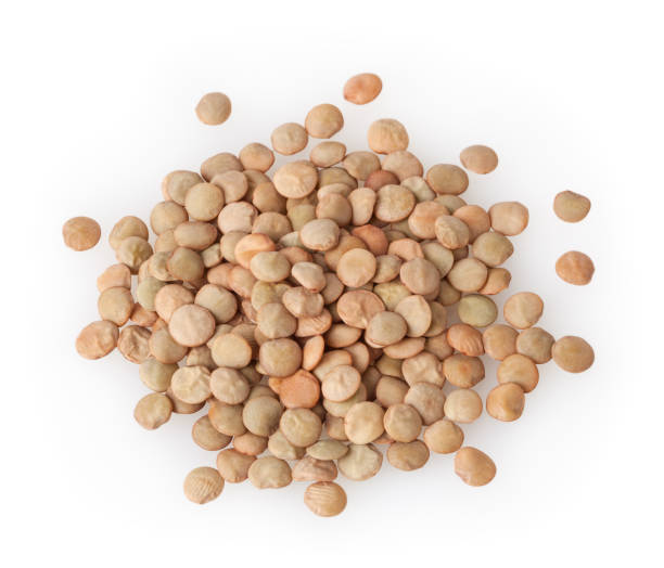 istock Heap of uncooked green lentils isolated on white background 910049114