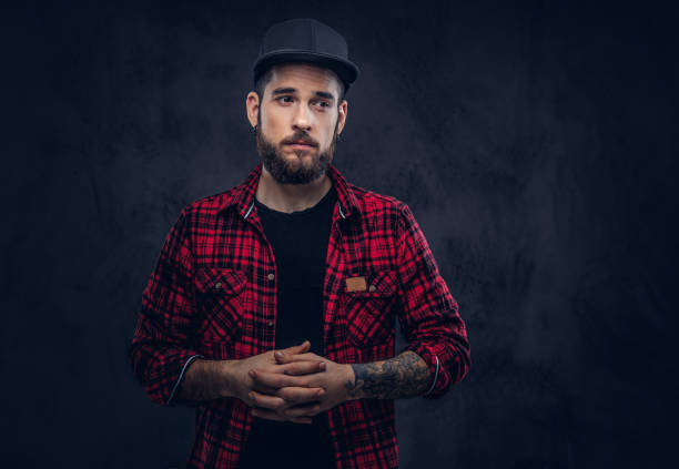 istock A bearded stylish hipster male with a tattoo. 910052458