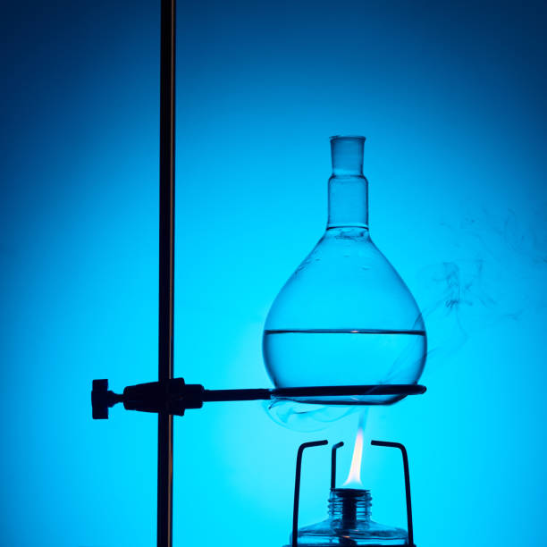 istock warming up liquid for chemical test isolated on blue 910052636
