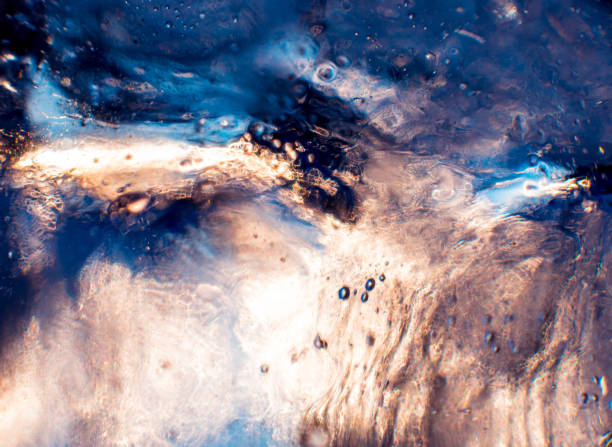 istock Beautiful abstract background. Ice close-up. The play of light. 910052910