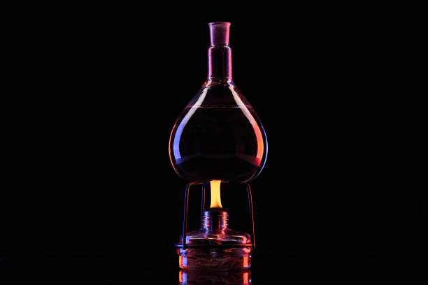 istock heating glass jar with liquid in laboratory on black 910052980