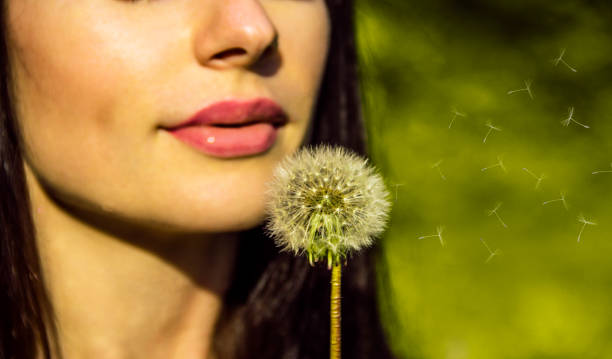 istock the girl with a dandelion 910053000