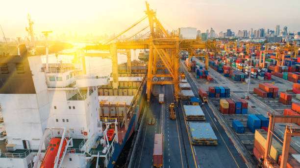 istock container,container ship in import export and business logistic,By crane,Trade Port , Shipping,cargo to harbor.Aerial view,Water transport,International,Shell Marine,transportation,logistic,trade,port 910057046