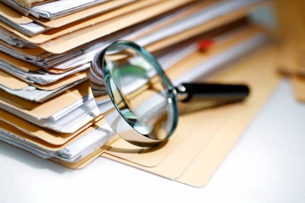 Documents Search Magnifying glass Search Documents ; shot with very shallow depth of field Exploration stock pictures, royalty-free photos & images