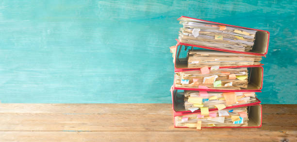 stack of messy file folders and documents,red tape concept,free copy space - red tape imagens e fotografias de stock