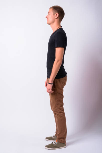 istock Portrait Of Young Man Against White Background 910061718
